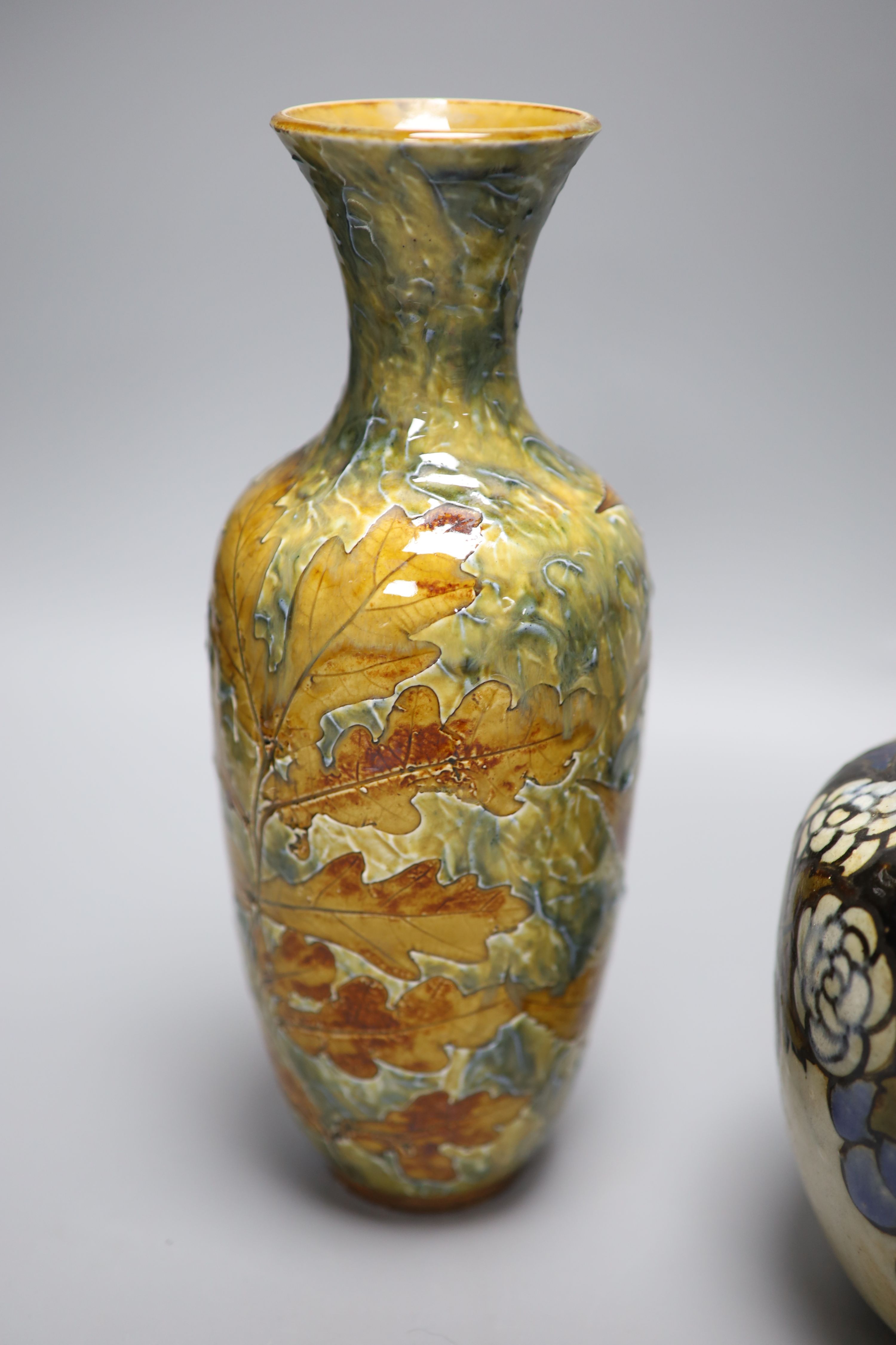 A Doulton Lambeth Autumn leaves vase and a Royal Doulton stoneware vase, tallest 27.5cm